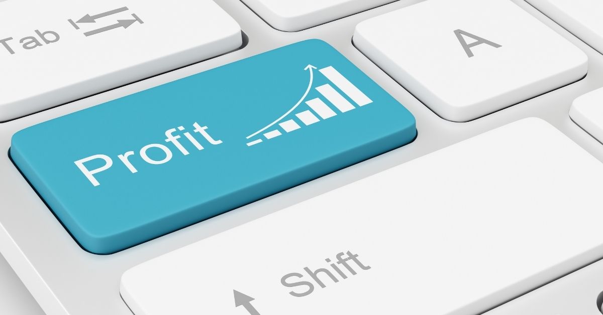 White keyboard with a pale-blue key that reads Profit with an up-arrow above a graph set in white on tope of the key.